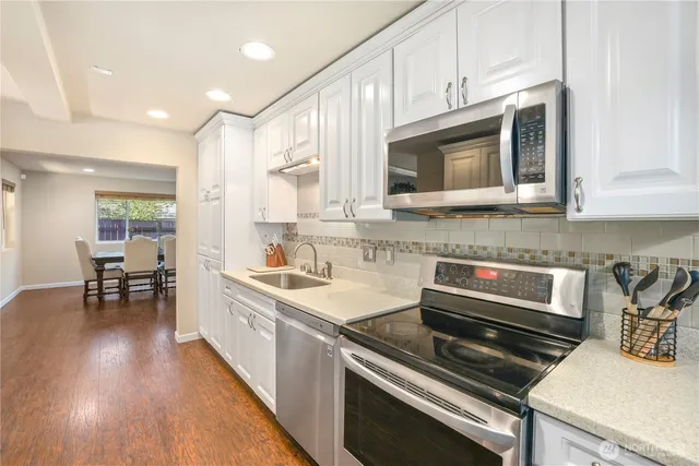 a kitchen with a stove and a microwave
