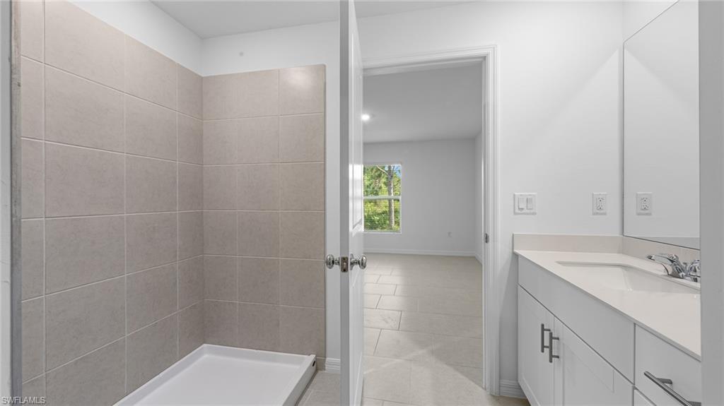 3717 23rd Street Southwest Lehigh Acres, FL 33976 - Photo 24 of 26 a bathroom with a shower and a sink