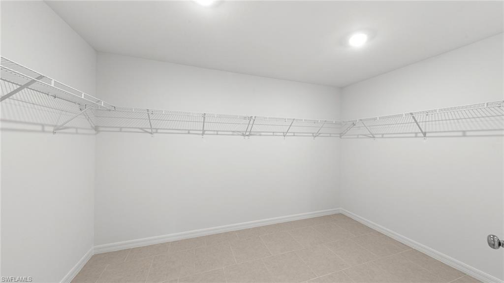 3717 23rd Street Southwest Lehigh Acres, FL 33976 - Photo 25 of 26 a view of a room with racks on the wall