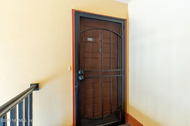 a bathroom with a shower and a mirror