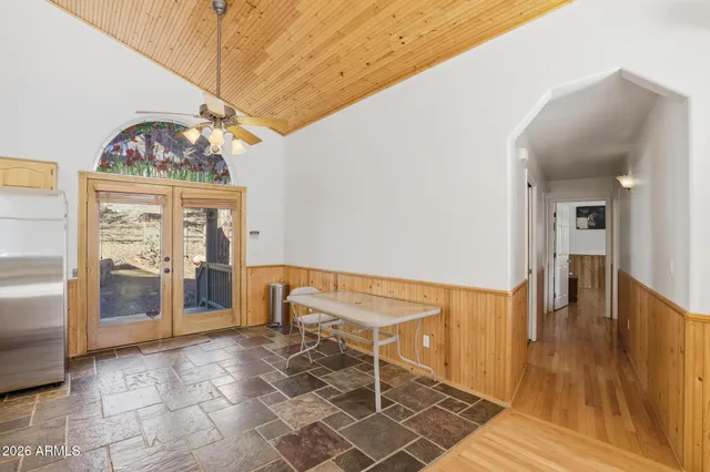 a kitchen with stainless steel appliances a refrigerator and a table