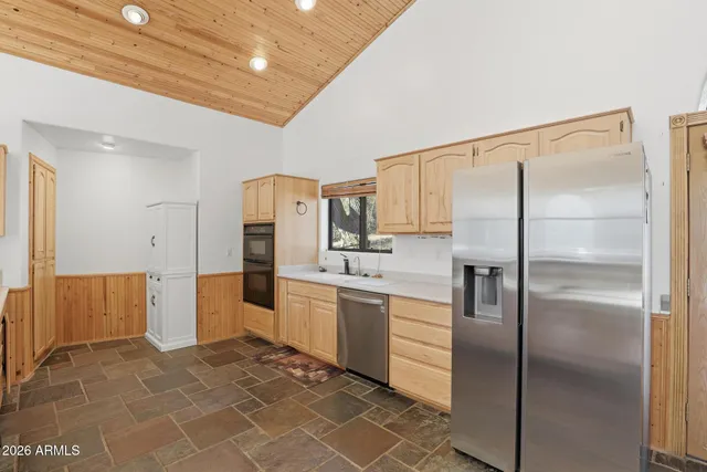 a bedroom with a bed and a fireplace