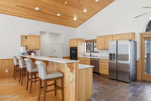 a bathroom with a sink vanity and shower
