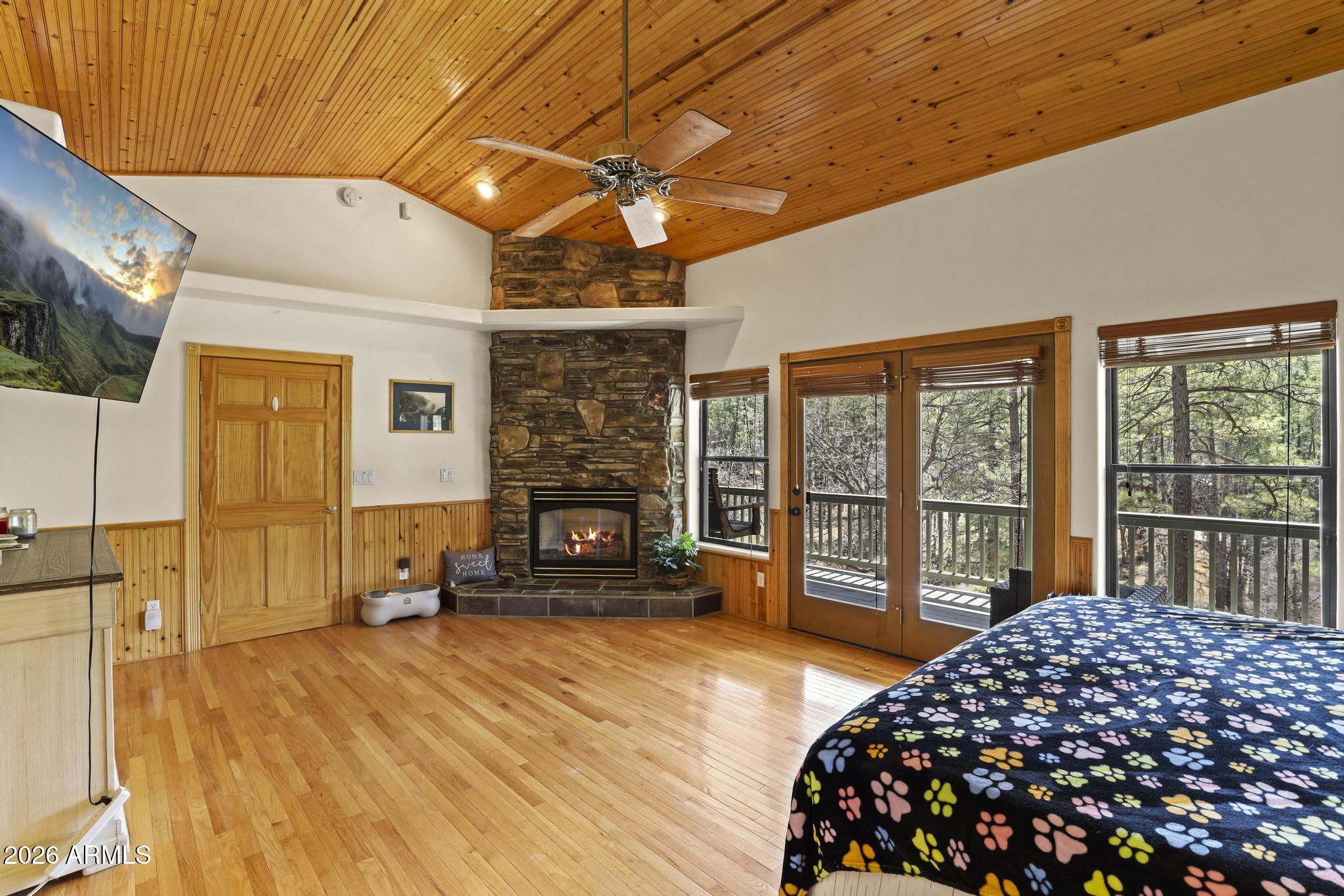 178 Memory Lane Payson, AZ 85541 - Photo 29 of 58 a bedroom with a bed and wooden floor