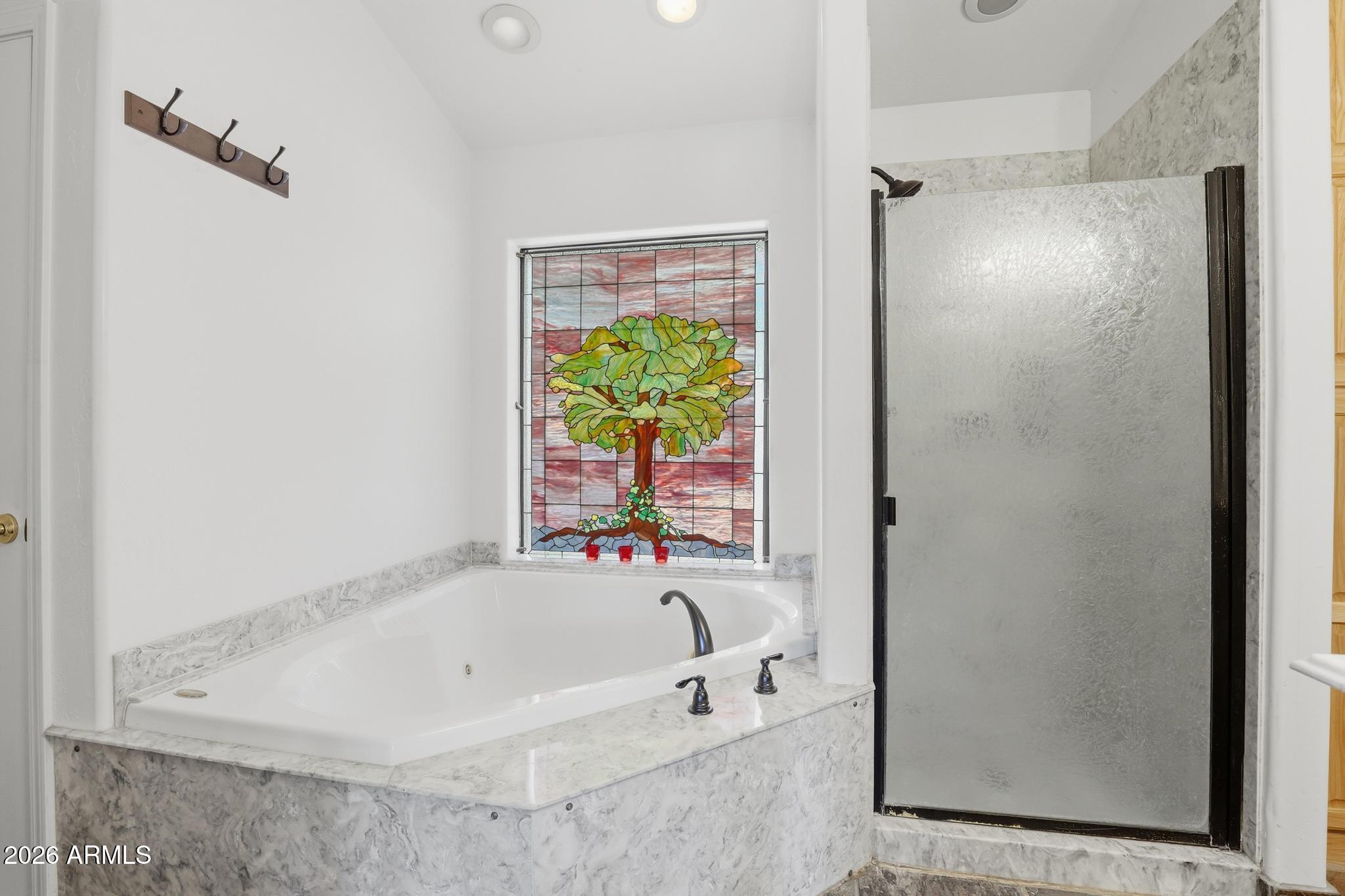 178 Memory Lane Payson, AZ 85541 - Photo 30 of 58 a white bath tub sitting next to a window