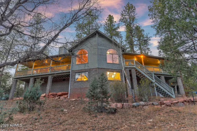 a view of a house with brick walls and plants