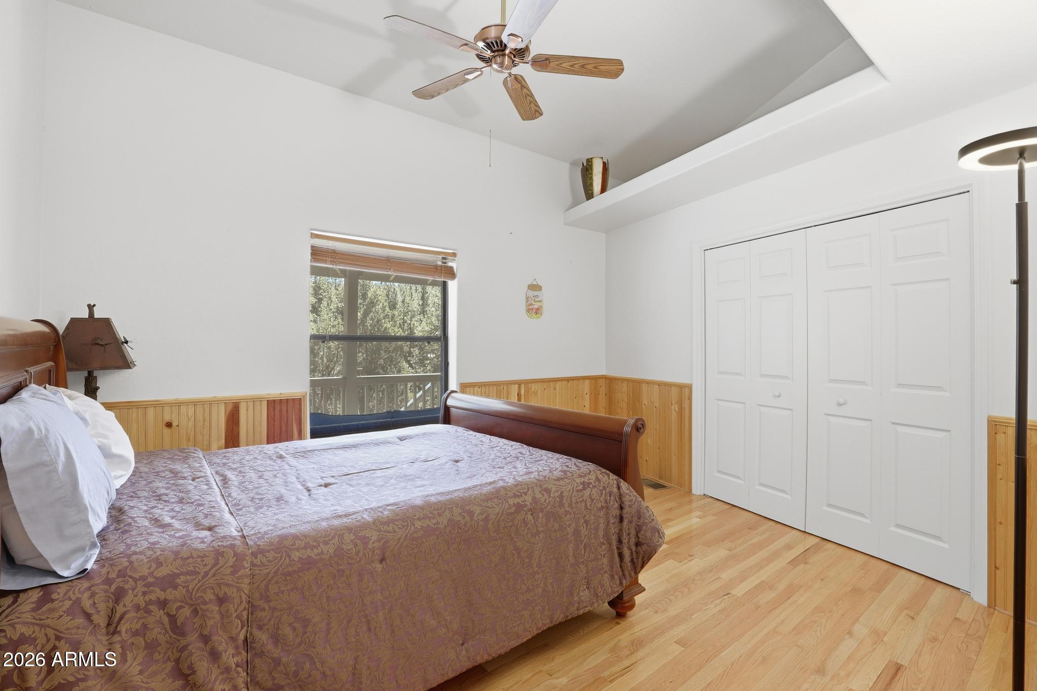 178 Memory Lane Payson, AZ 85541 - Photo 36 of 58 a bedroom with a bed and wooden floor