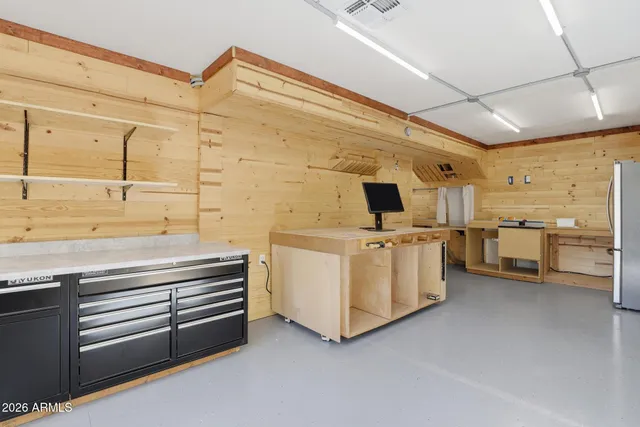 a backyard of a house with large tree