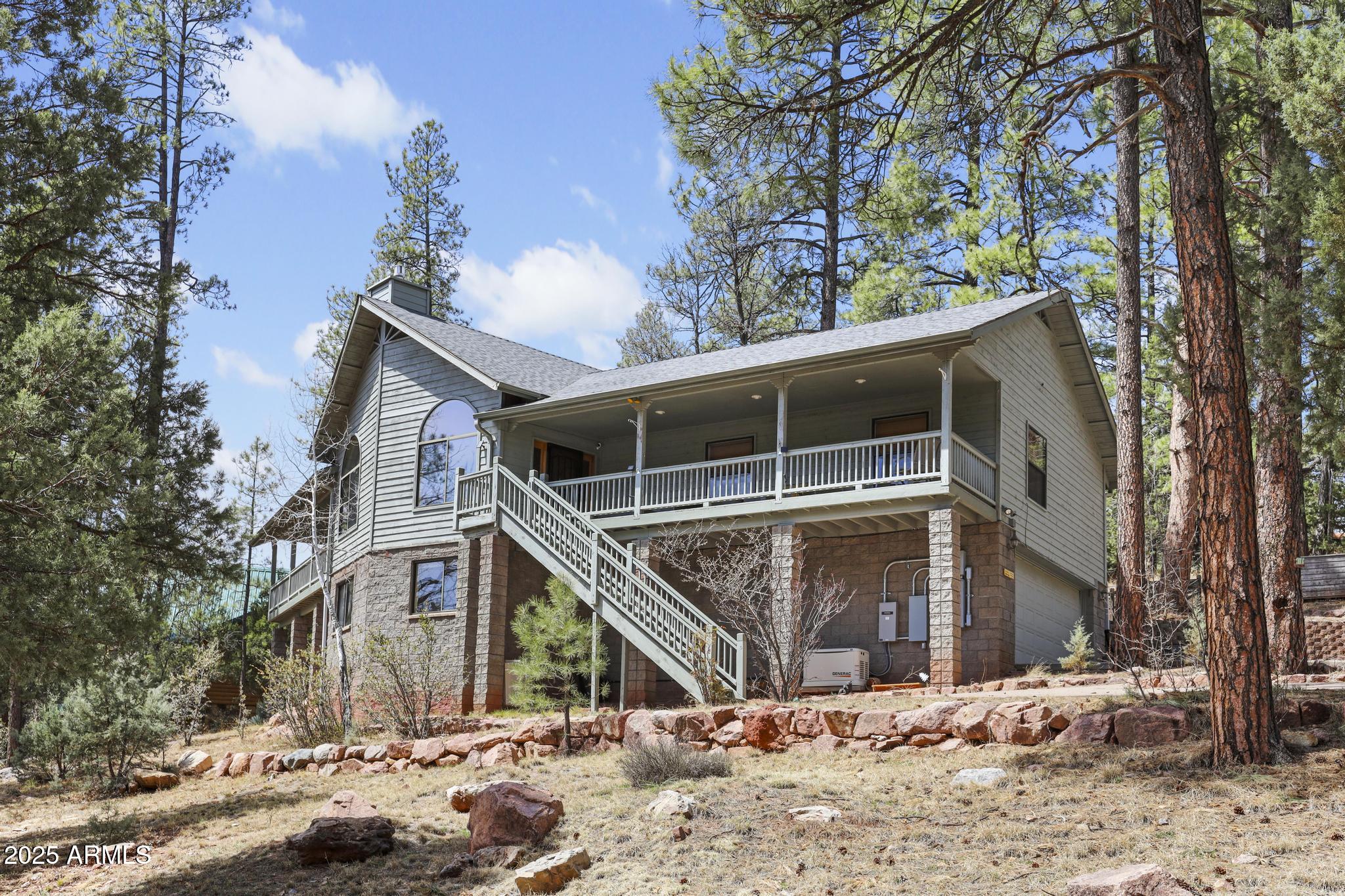 178 Memory Lane Payson, AZ 85541 - Photo 8 of 58 a front view of a house with a yard covered in snow