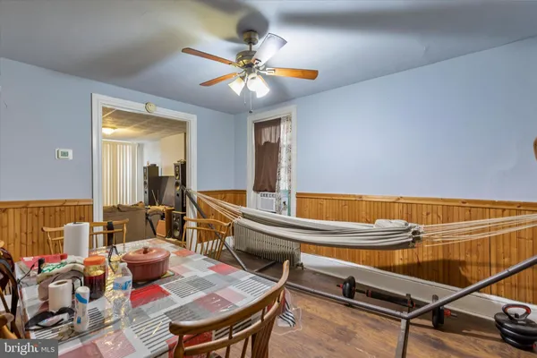 a living room with a table tennis pool table and chairs