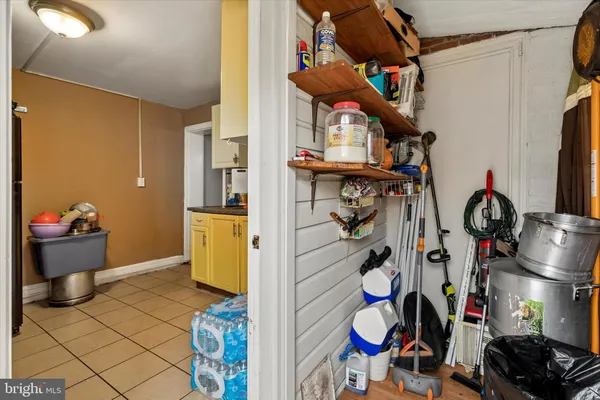 a view of a entryway with storage and utility room