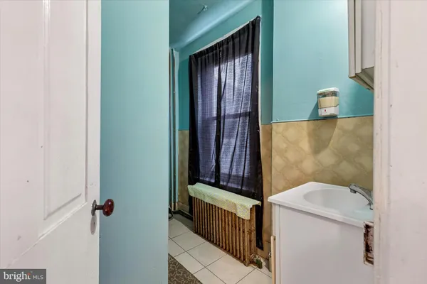 a bathroom with a toilet and a sink