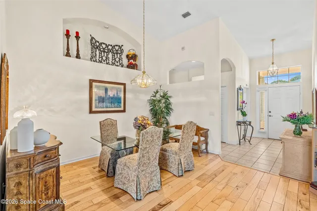a view of a dining room with furniture window and outside view