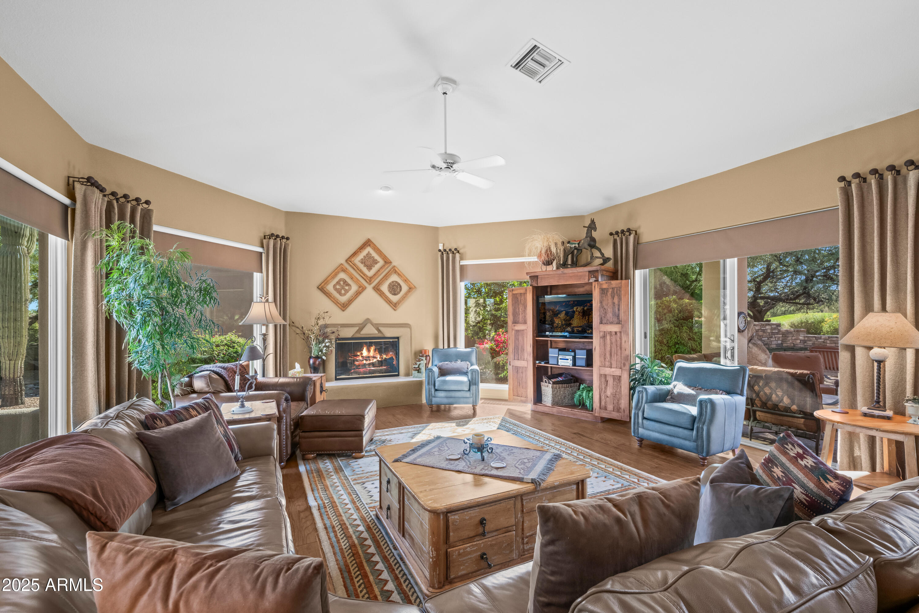 27408 North Agua Verde Drive Rio Verde, AZ 85263 - Photo 11 of 40 a living room with furniture and a large window