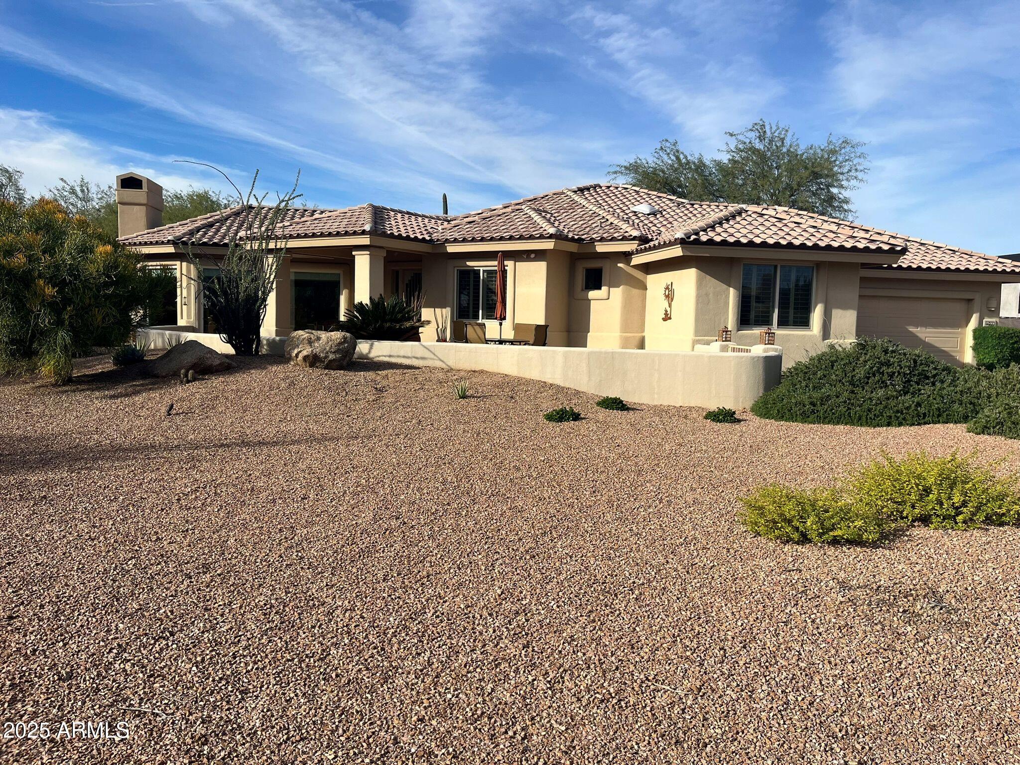 27408 North Agua Verde Drive Rio Verde, AZ 85263 - Photo 2 of 40 a front view of a house with a yard