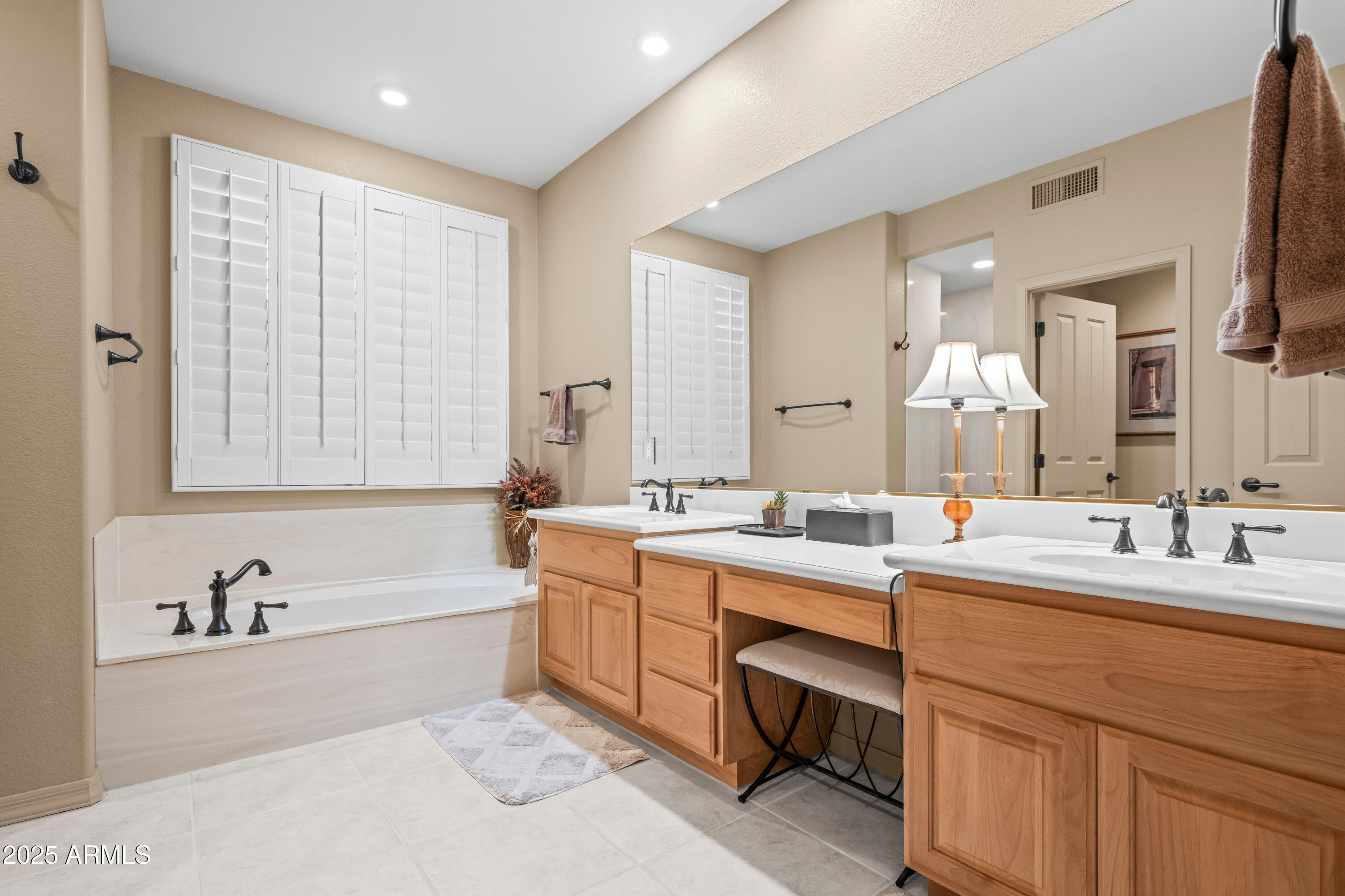 27408 North Agua Verde Drive Rio Verde, AZ 85263 - Photo 24 of 40 a bathroom with a tub sink and mirror