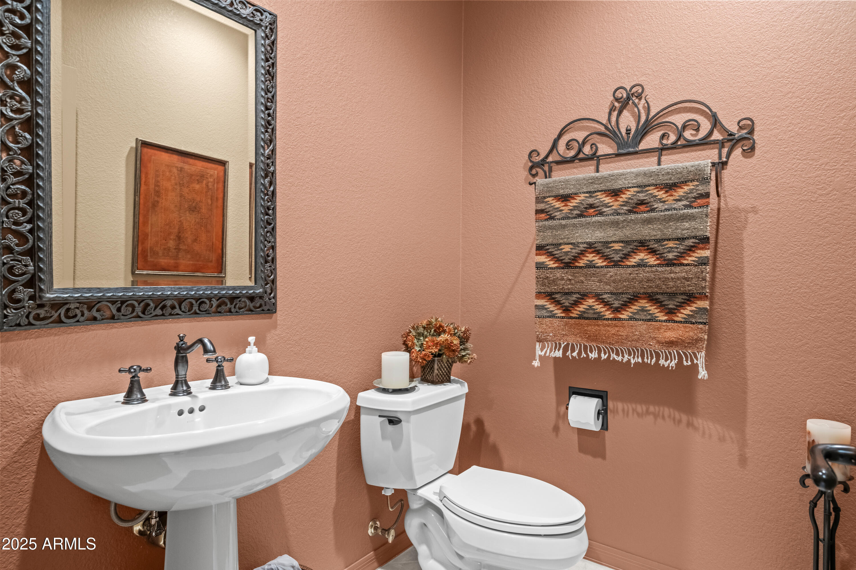 27408 North Agua Verde Drive Rio Verde, AZ 85263 - Photo 30 of 40 a bathroom with a sink a mirror and a toilet