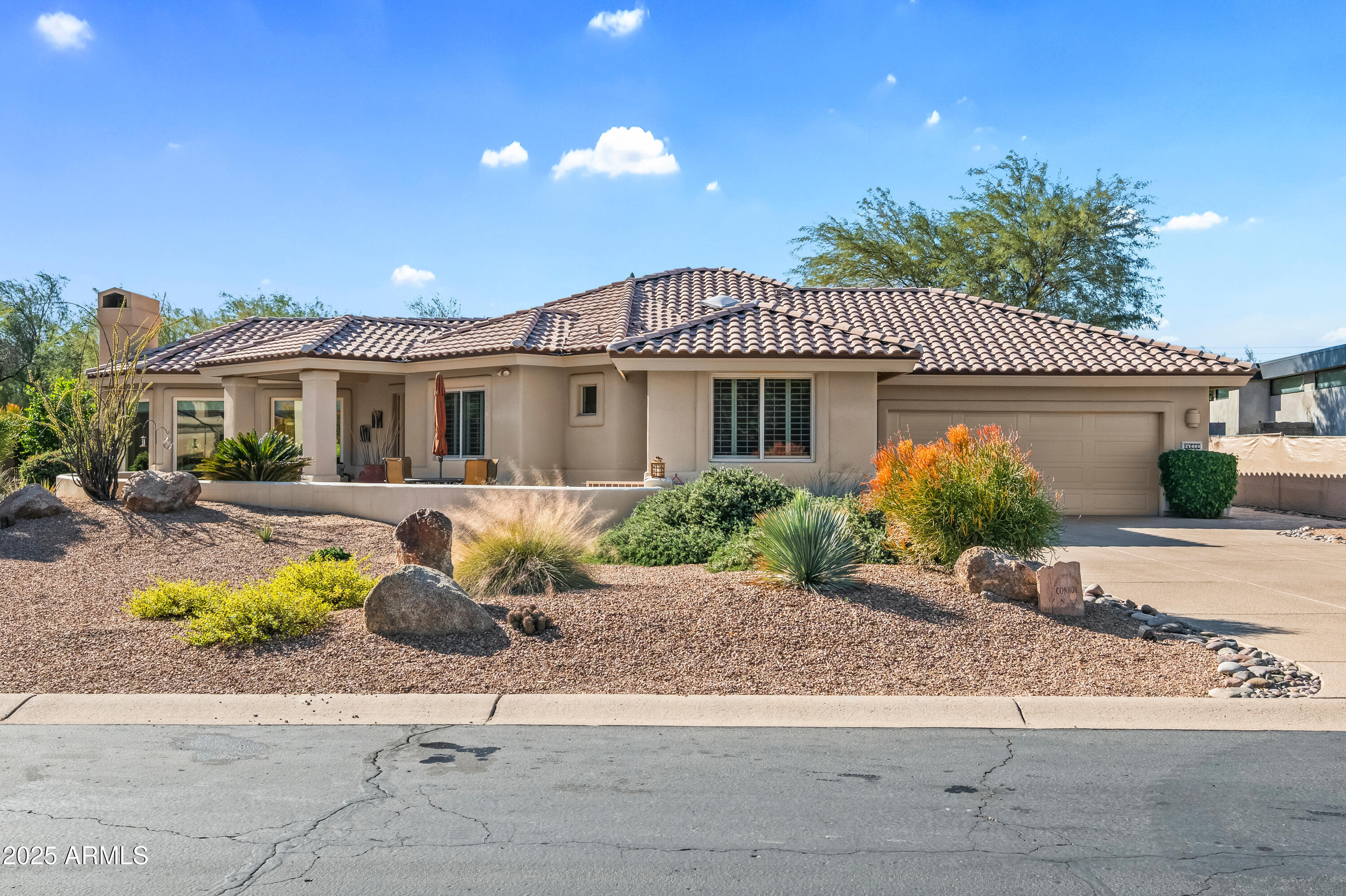 27408 North Agua Verde Drive Rio Verde, AZ 85263 - Photo 5 of 40 a front view of a house with swimming pool