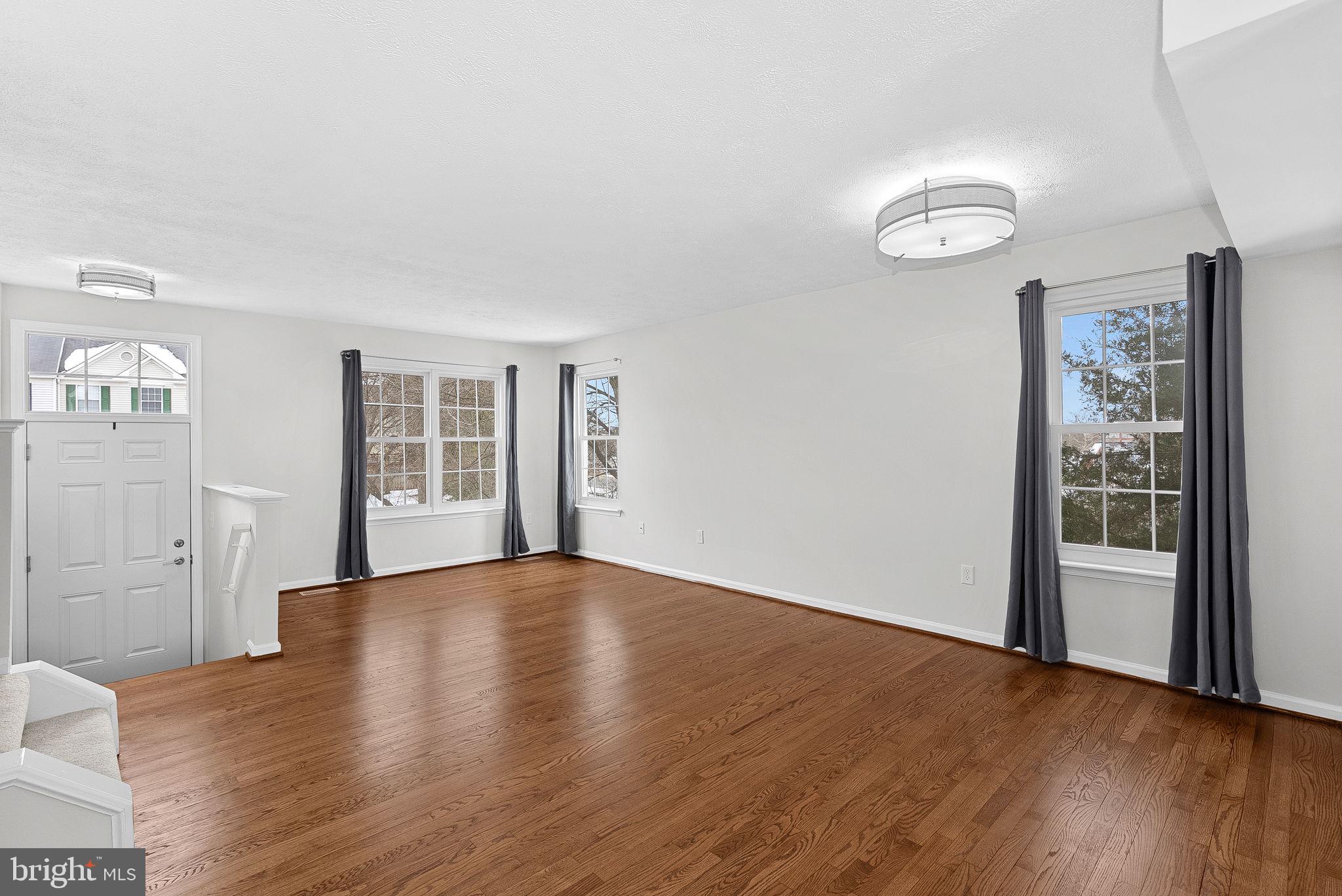 20718 Apollo Terrace Ashburn, VA 20147 - Photo 4 of 44 Sunny Living Space w/Refinished Hardwood Floors