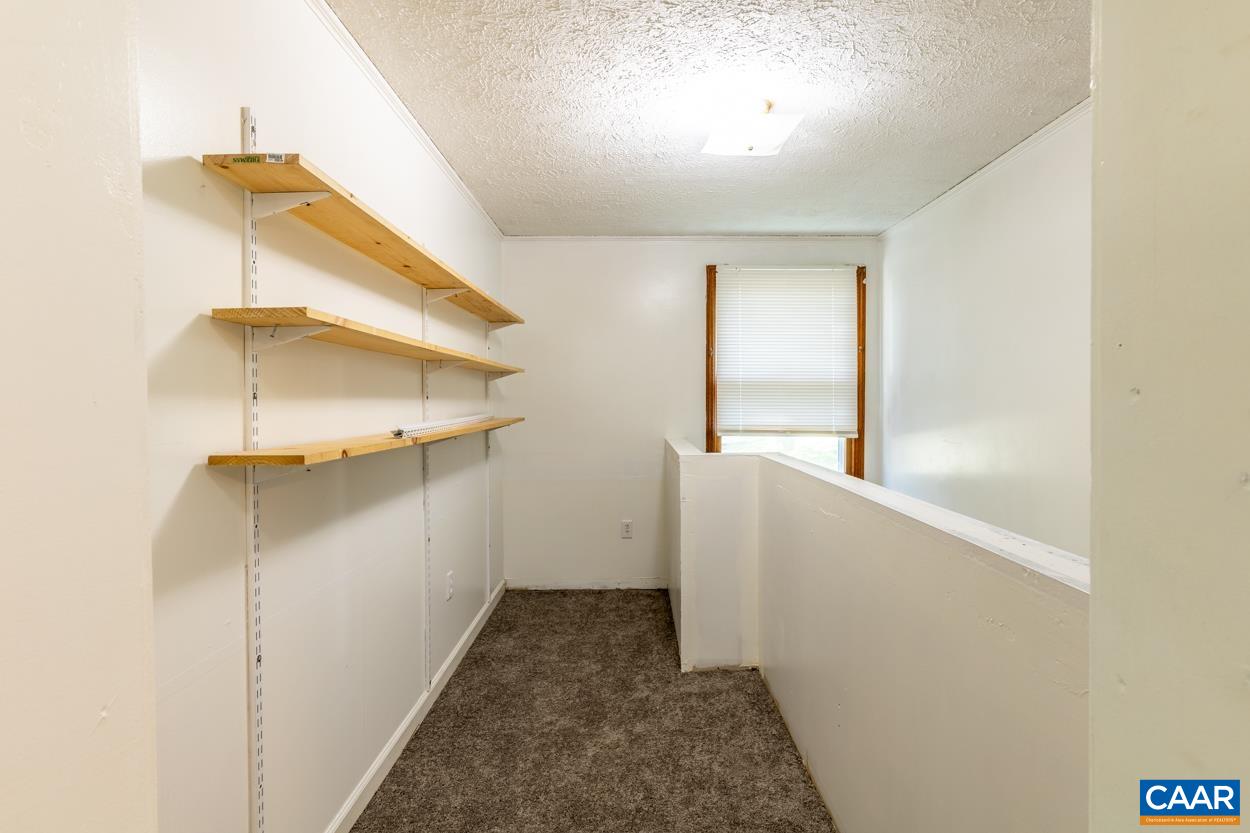 327 Village Road Shipman, VA 22971 - Photo 26 of 48 a view of walk in closet with window