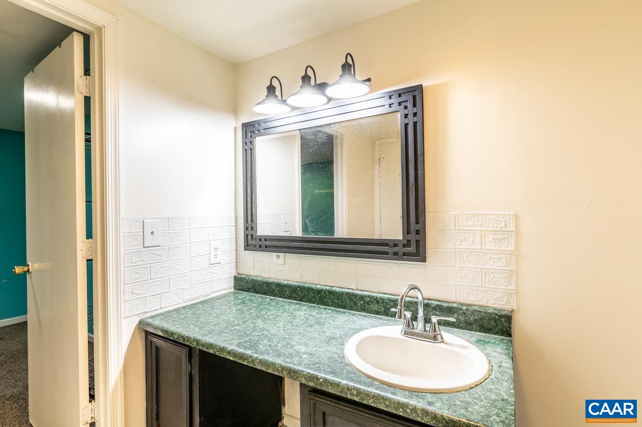 327 Village Road Shipman, VA 22971 - Photo 43 of 48 a bathroom with a sink and a mirror