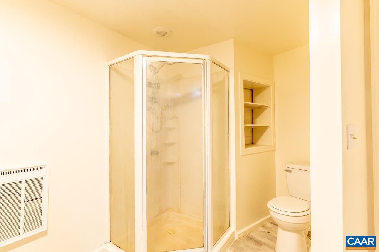 327 Village Road Shipman, VA 22971 - Photo 45 of 48 a bathroom with a toilet and shower