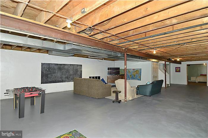 8811 Warfield Road Gaithersburg, MD 20882 - Photo 26 of 30 Lower-Level Recreation Room