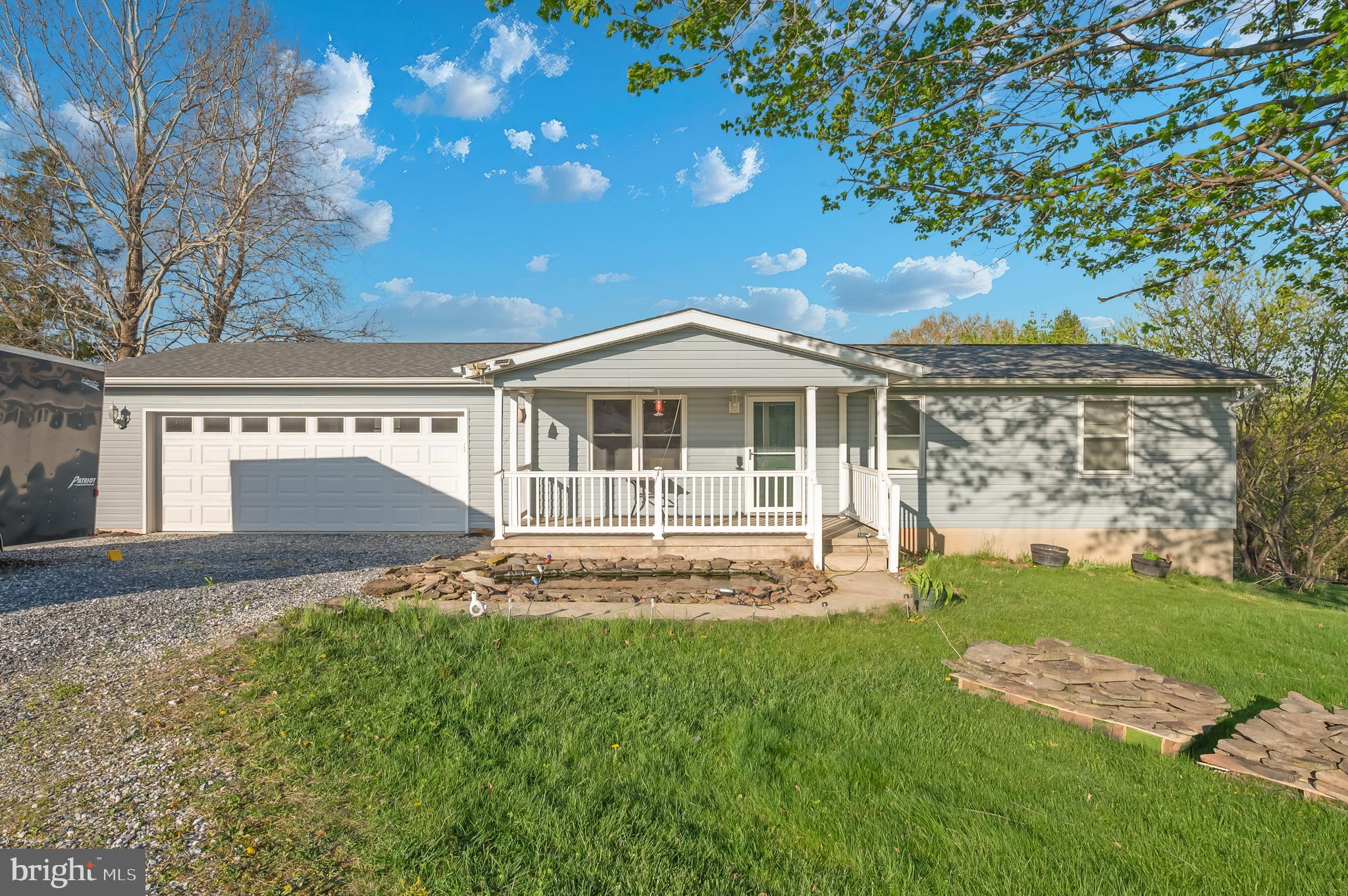 a view of house with backyard
