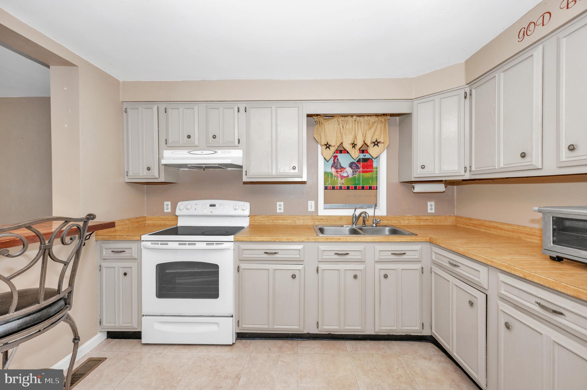 13411 Rabbit Run Terrace Union Bridge, MD 21791 - Photo 12 of 47 a kitchen with cabinets appliances and a sink