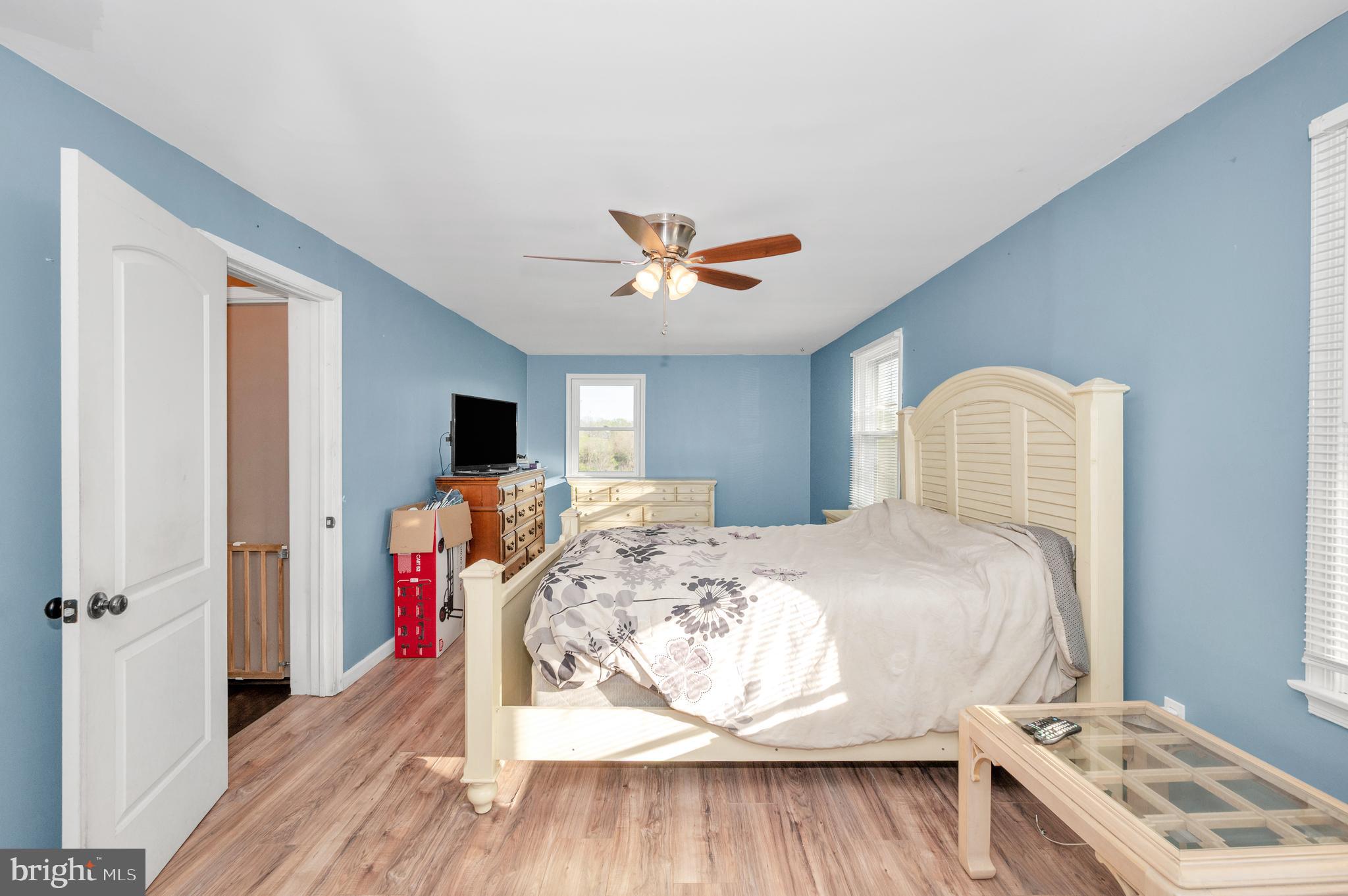 13411 Rabbit Run Terrace Union Bridge, MD 21791 - Photo 16 of 47 a bedroom with a bed and a chandelier