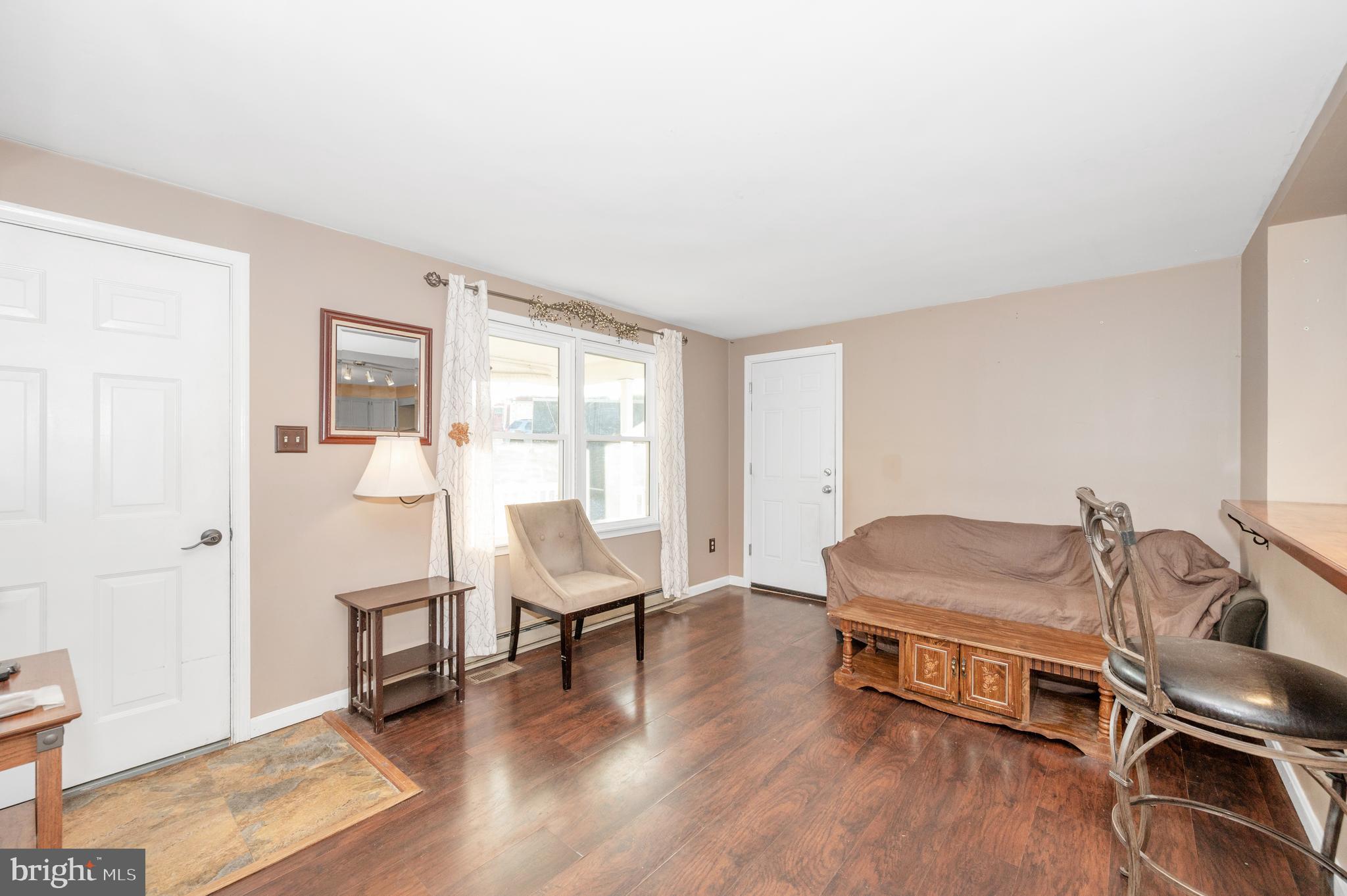 13411 Rabbit Run Terrace Union Bridge, MD 21791 - Photo 2 of 47 a living room with furniture and a wooden floor
