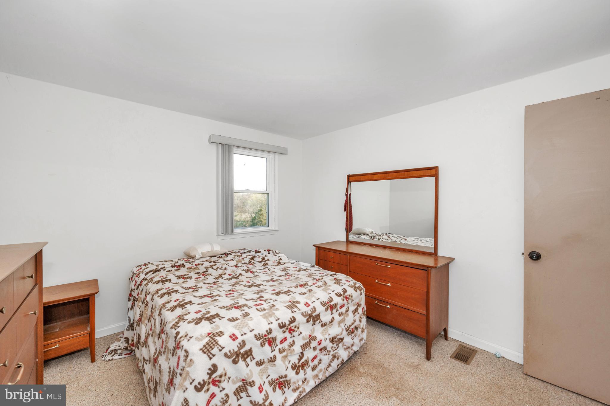 13411 Rabbit Run Terrace Union Bridge, MD 21791 - Photo 21 of 47 a bedroom with a bed and a dresser