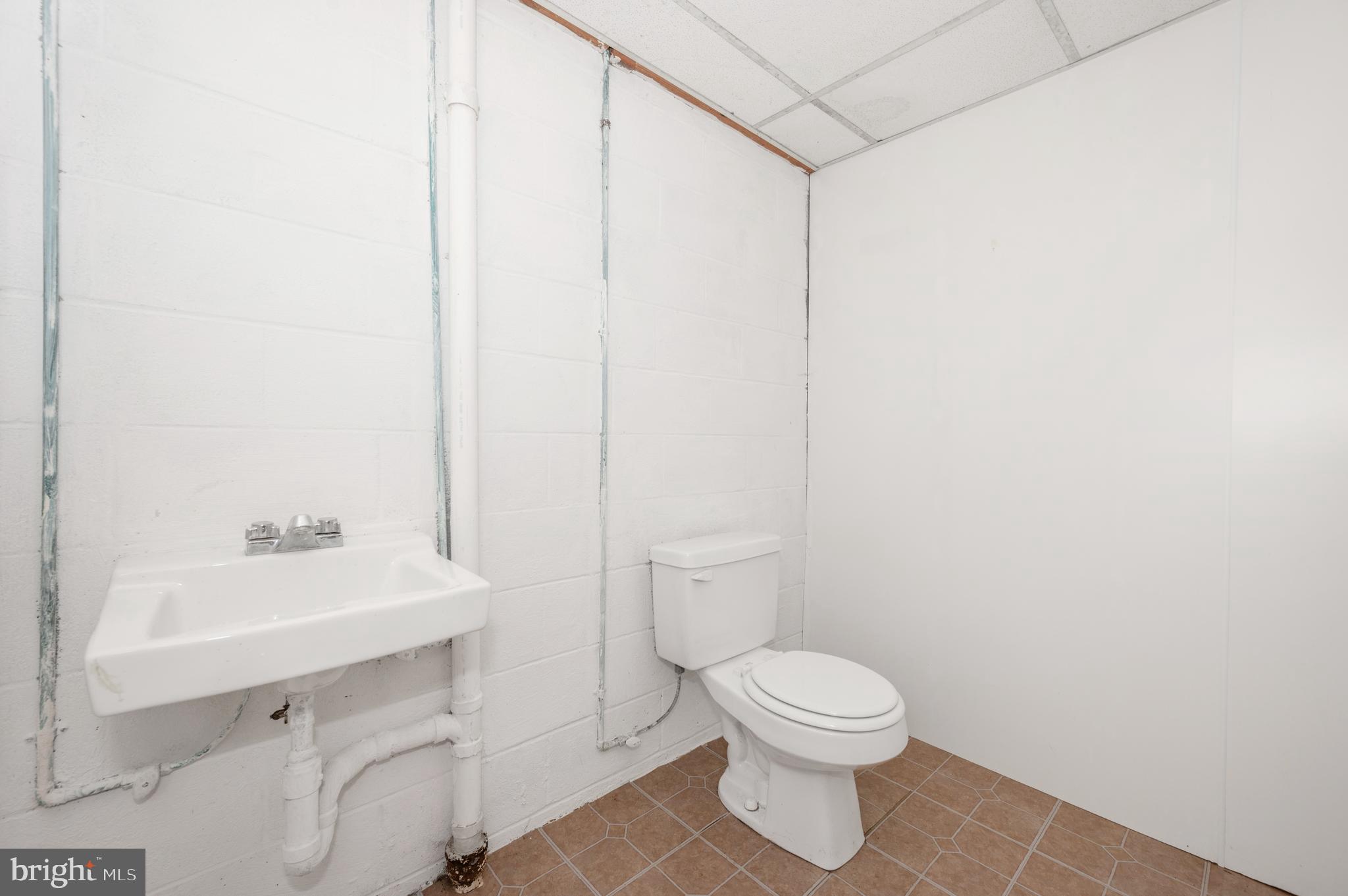 13411 Rabbit Run Terrace Union Bridge, MD 21791 - Photo 34 of 47 a bathroom with a toilet a sink and a mirror