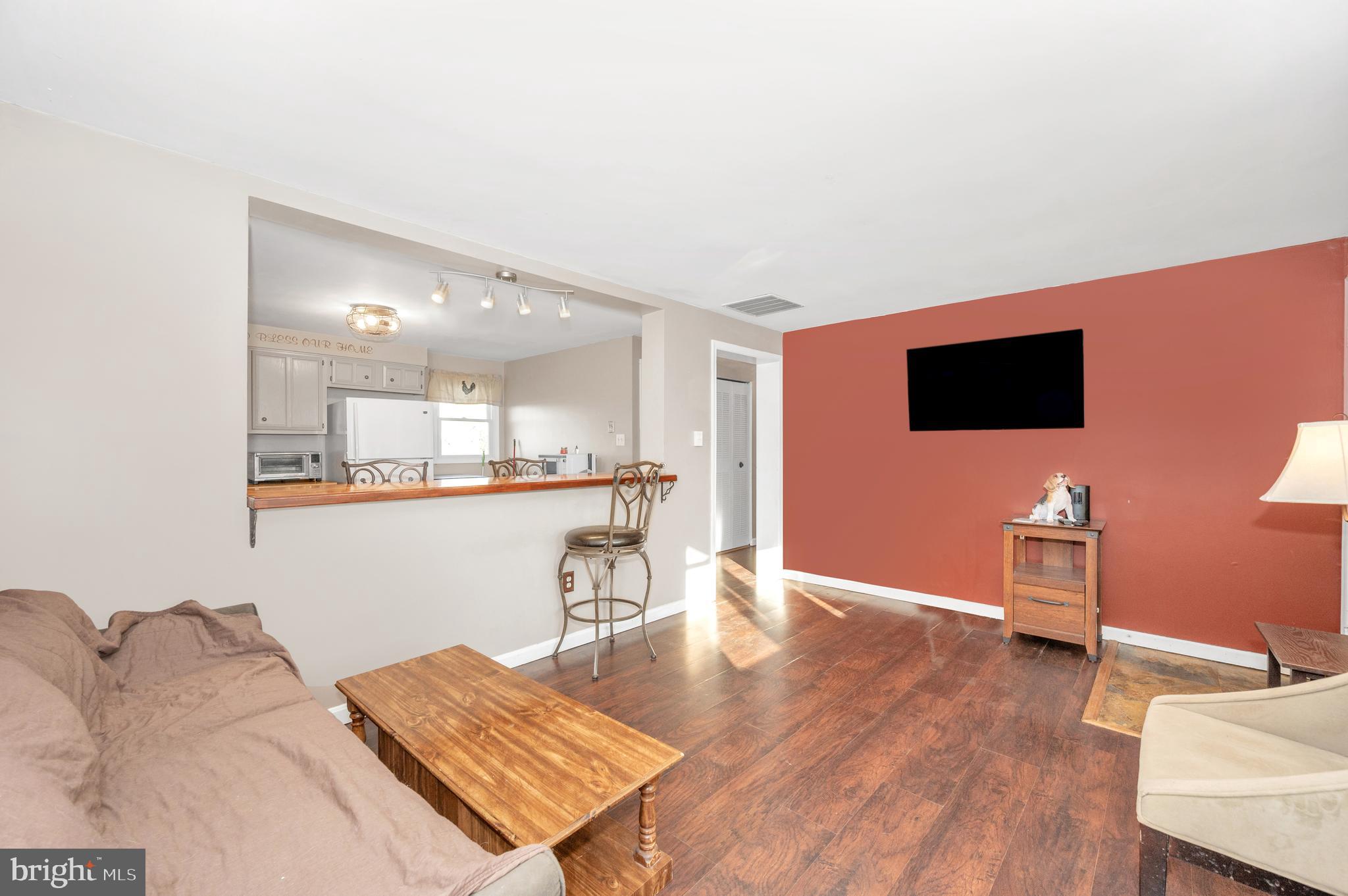 13411 Rabbit Run Terrace Union Bridge, MD 21791 - Photo 5 of 47 a living room with furniture and a flat screen tv