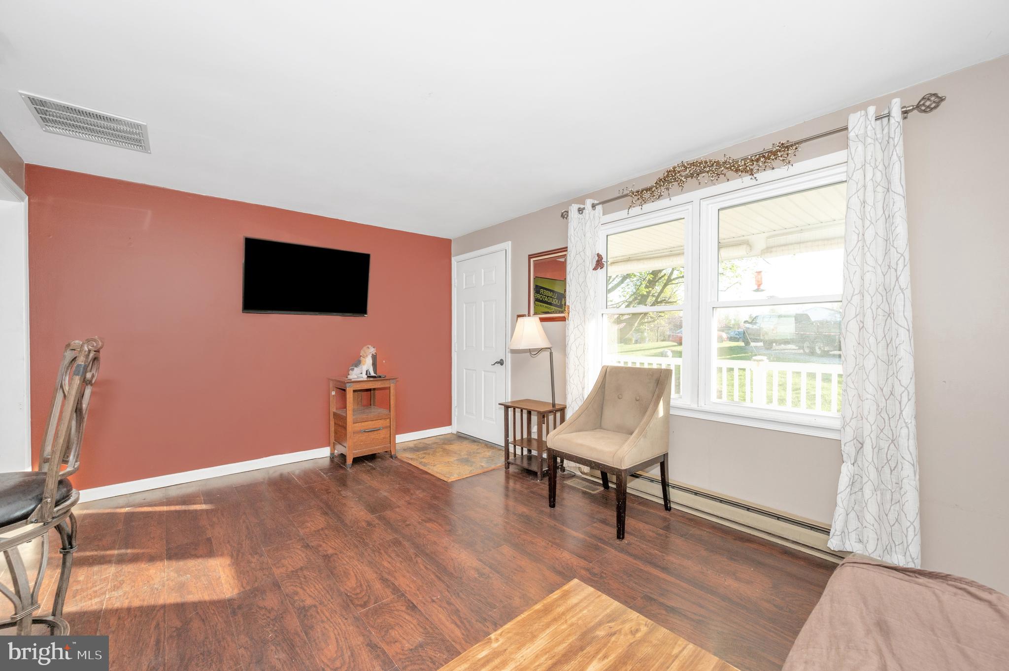 13411 Rabbit Run Terrace Union Bridge, MD 21791 - Photo 6 of 47 a living room with furniture and a flat screen tv
