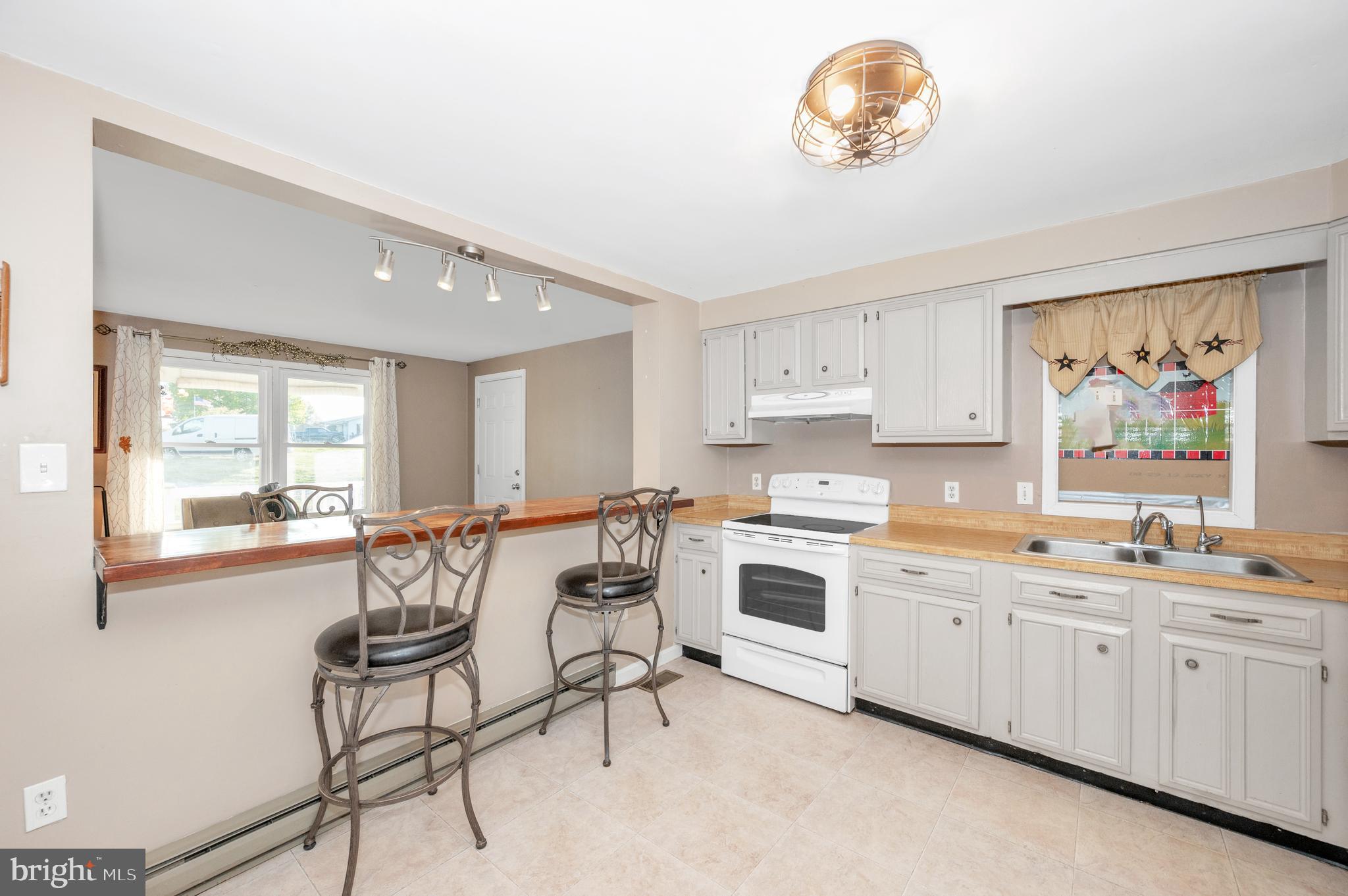 13411 Rabbit Run Terrace Union Bridge, MD 21791 - Photo 10 of 47 a kitchen with a sink cabinets and window