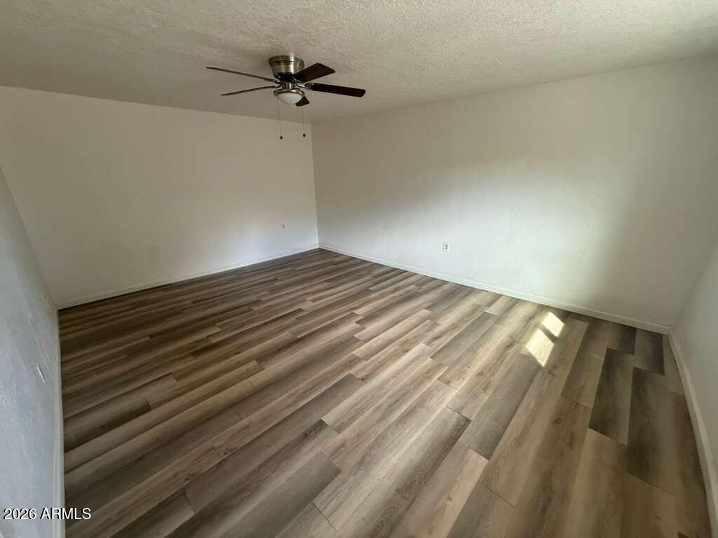 1258 East 15th Street Douglas, AZ 85607 - Photo 12 of 15 a view of empty room with wooden floor