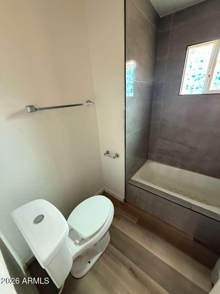 1258 East 15th Street Douglas, AZ 85607 - Photo 9 of 15 a bathroom with a toilet and a bathtub