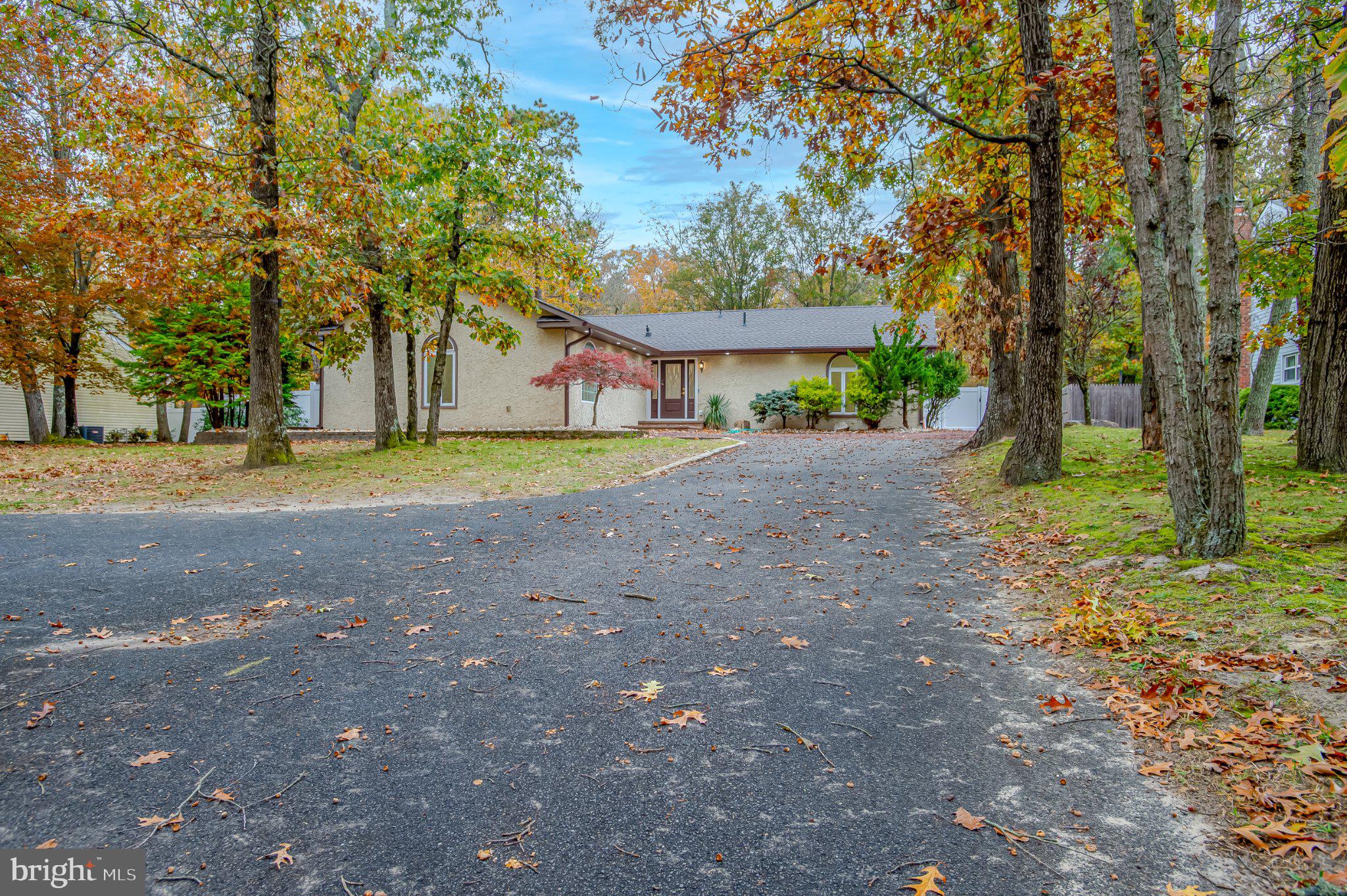 104 Hopewell Road Marlton, NJ 08053 - Photo 1 of 27 a view of a house with trees in the background