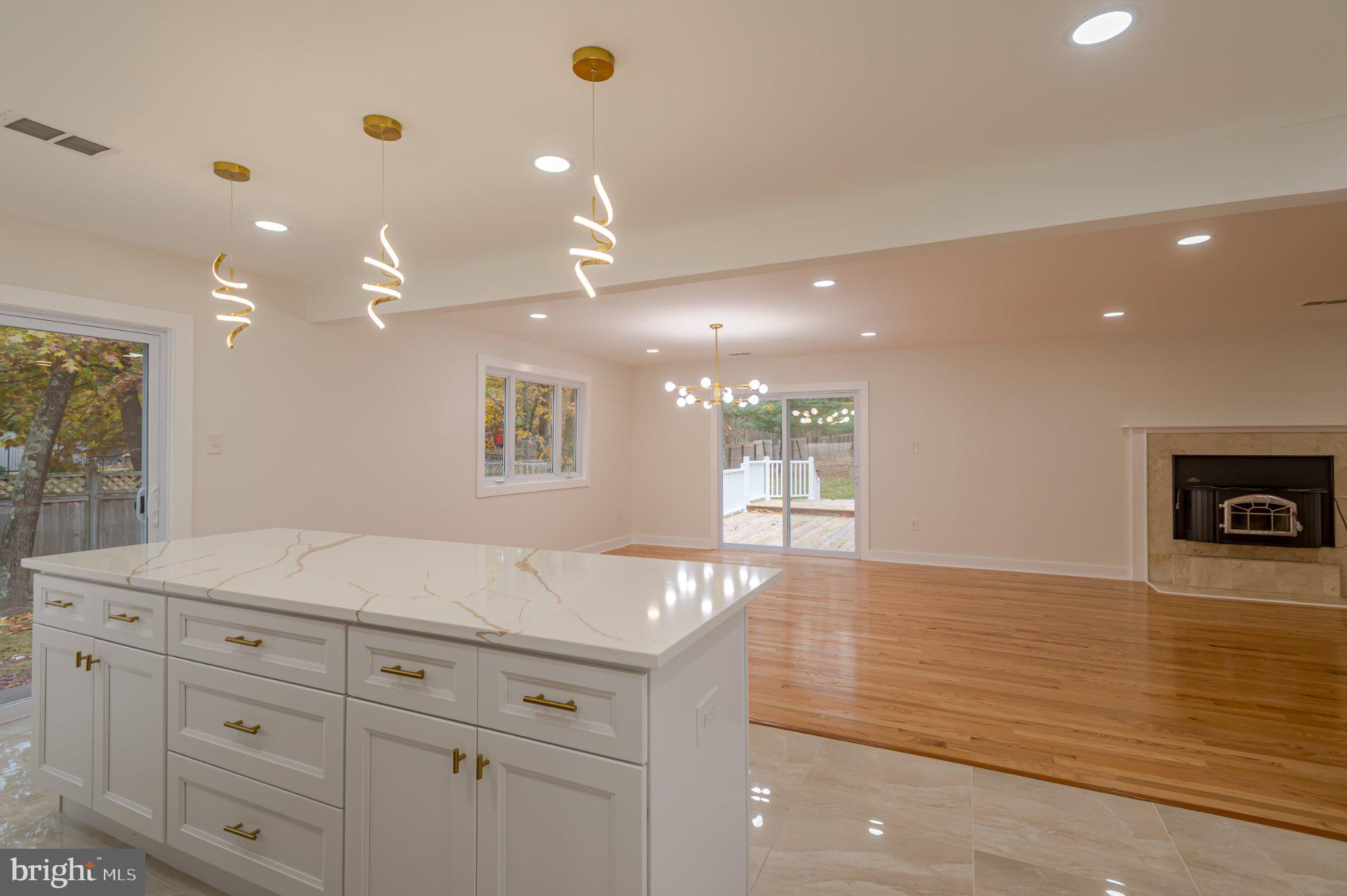 104 Hopewell Road Marlton, NJ 08053 - Photo 14 of 27 a view of a kitchen with kitchen island a sink stainless steel appliances and cabinets