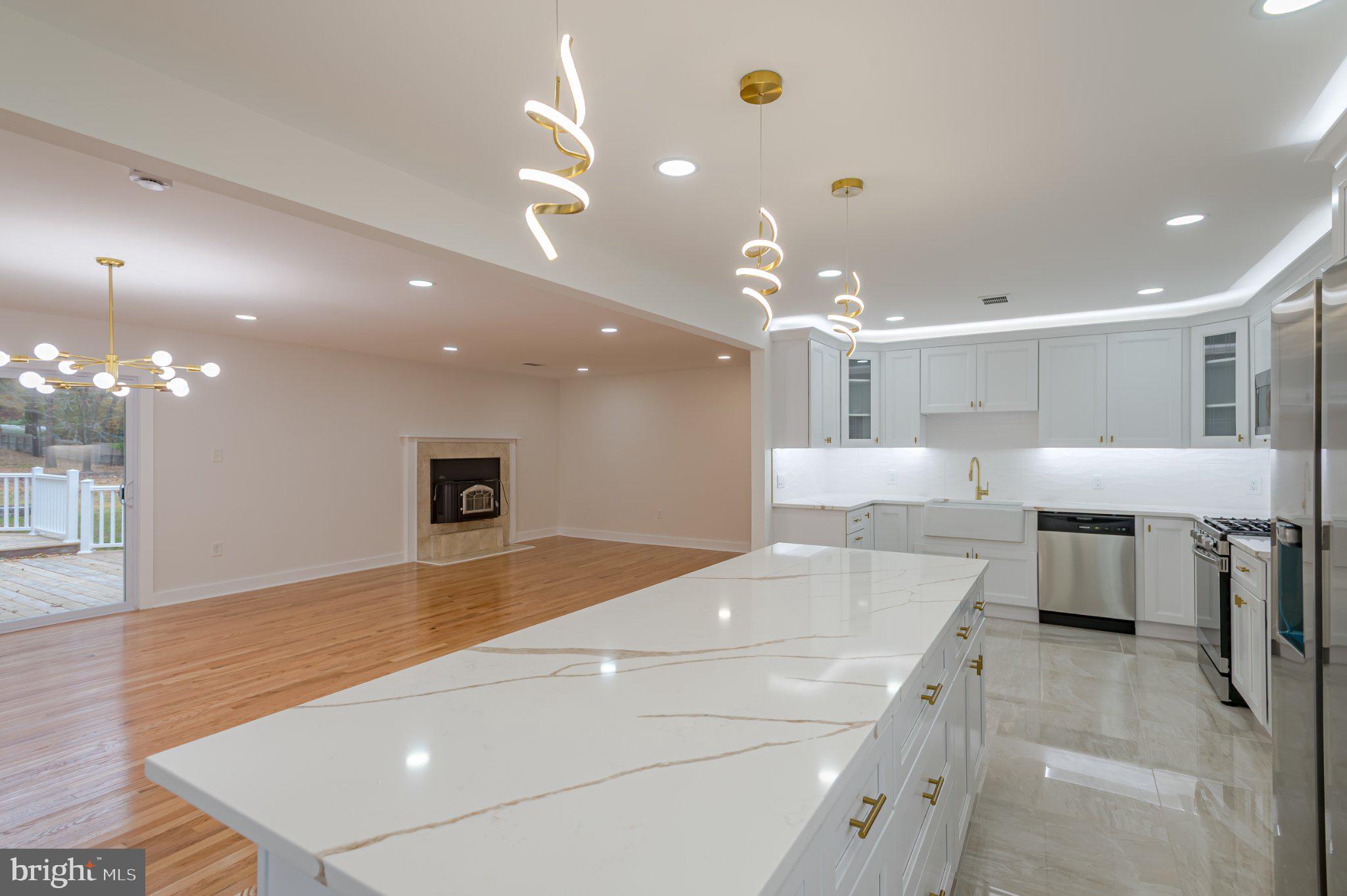 104 Hopewell Road Marlton, NJ 08053 - Photo 15 of 27 a large kitchen with a large counter top appliances and cabinets