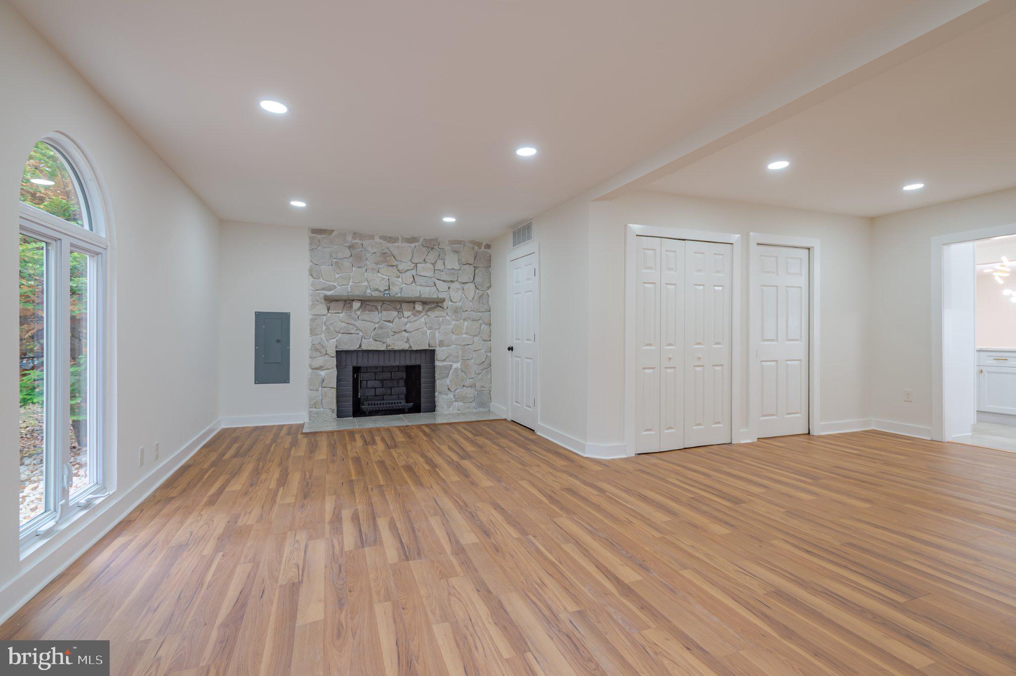 104 Hopewell Road Marlton, NJ 08053 - Photo 17 of 27 a view of an empty room with a fireplace and a window
