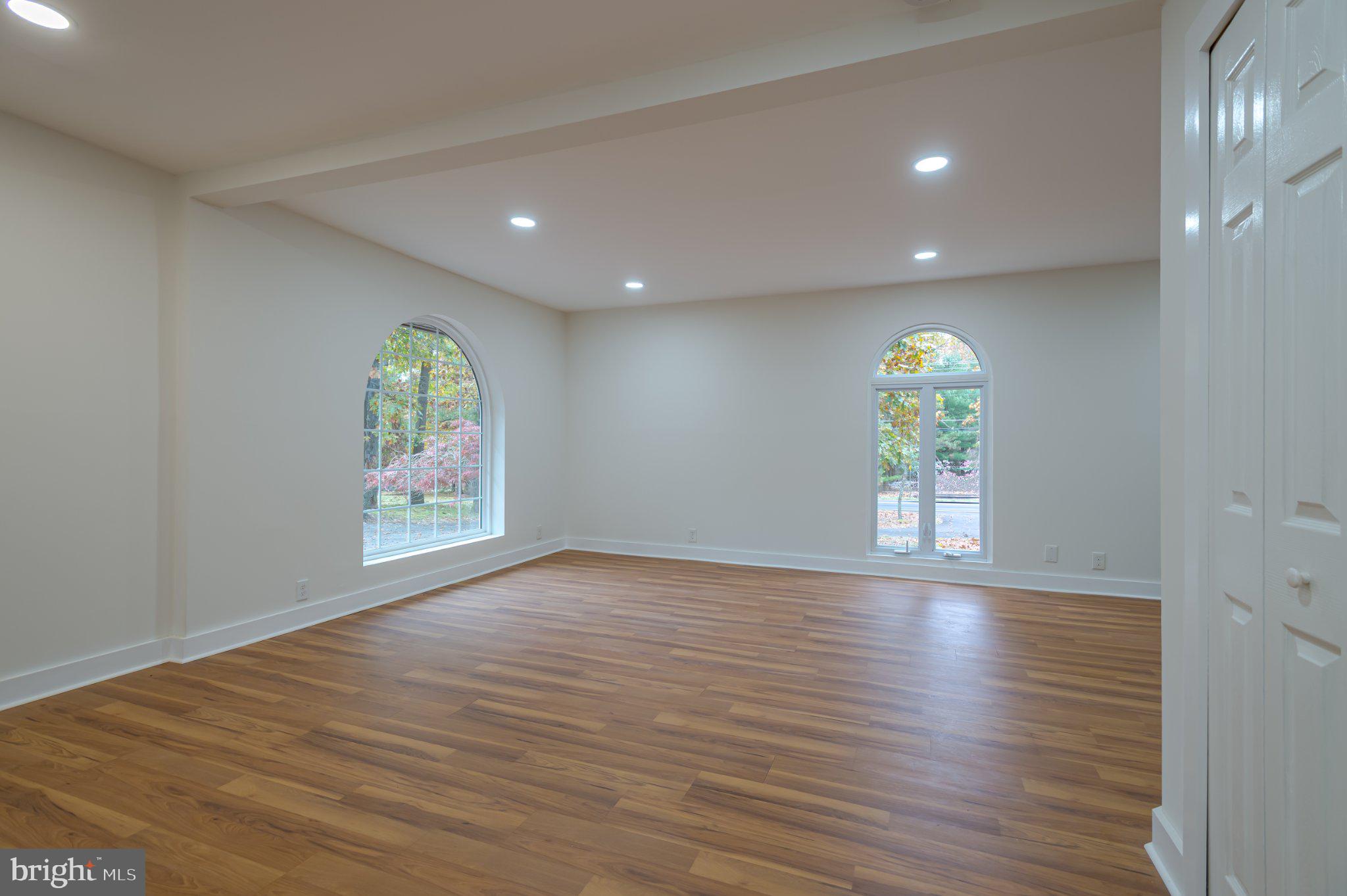 104 Hopewell Road Marlton, NJ 08053 - Photo 18 of 27 a view of an empty room with a window and wooden floor