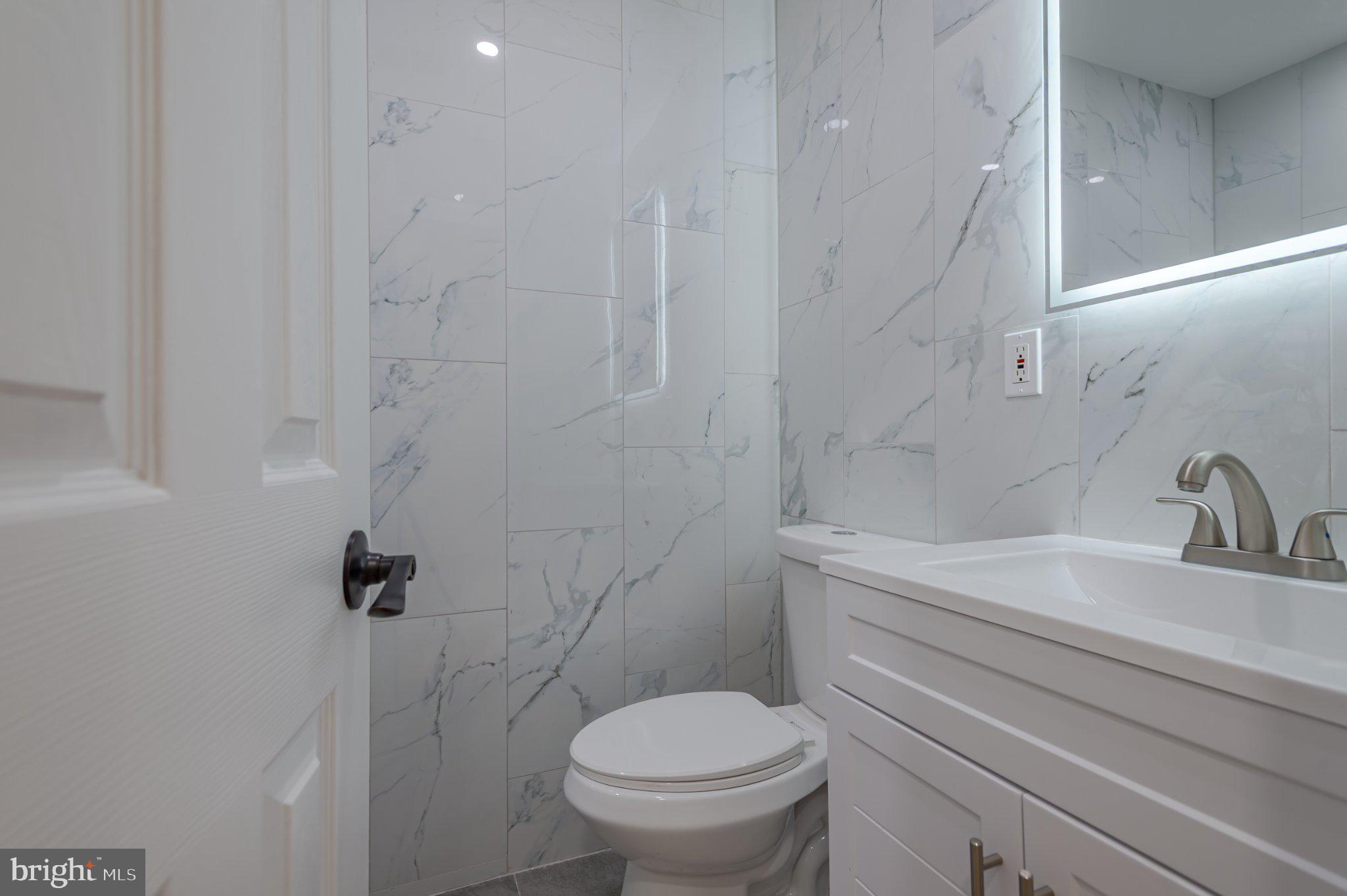 104 Hopewell Road Marlton, NJ 08053 - Photo 24 of 27 a bathroom with a sink a toilet and a mirror