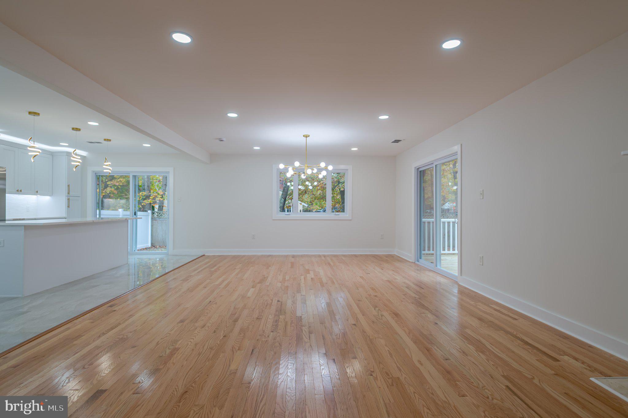 104 Hopewell Road Marlton, NJ 08053 - Photo 6 of 27 an empty room with wooden floor and windows