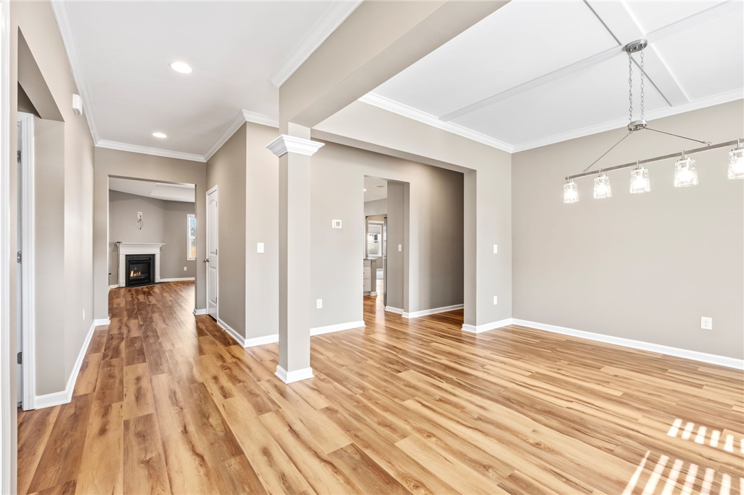 127 Spyglass Lane Pendleton, SC 29670 - Photo 9 of 45 Flowing hardwood floors and elegant crown moldings define this open-concept main-level living space.