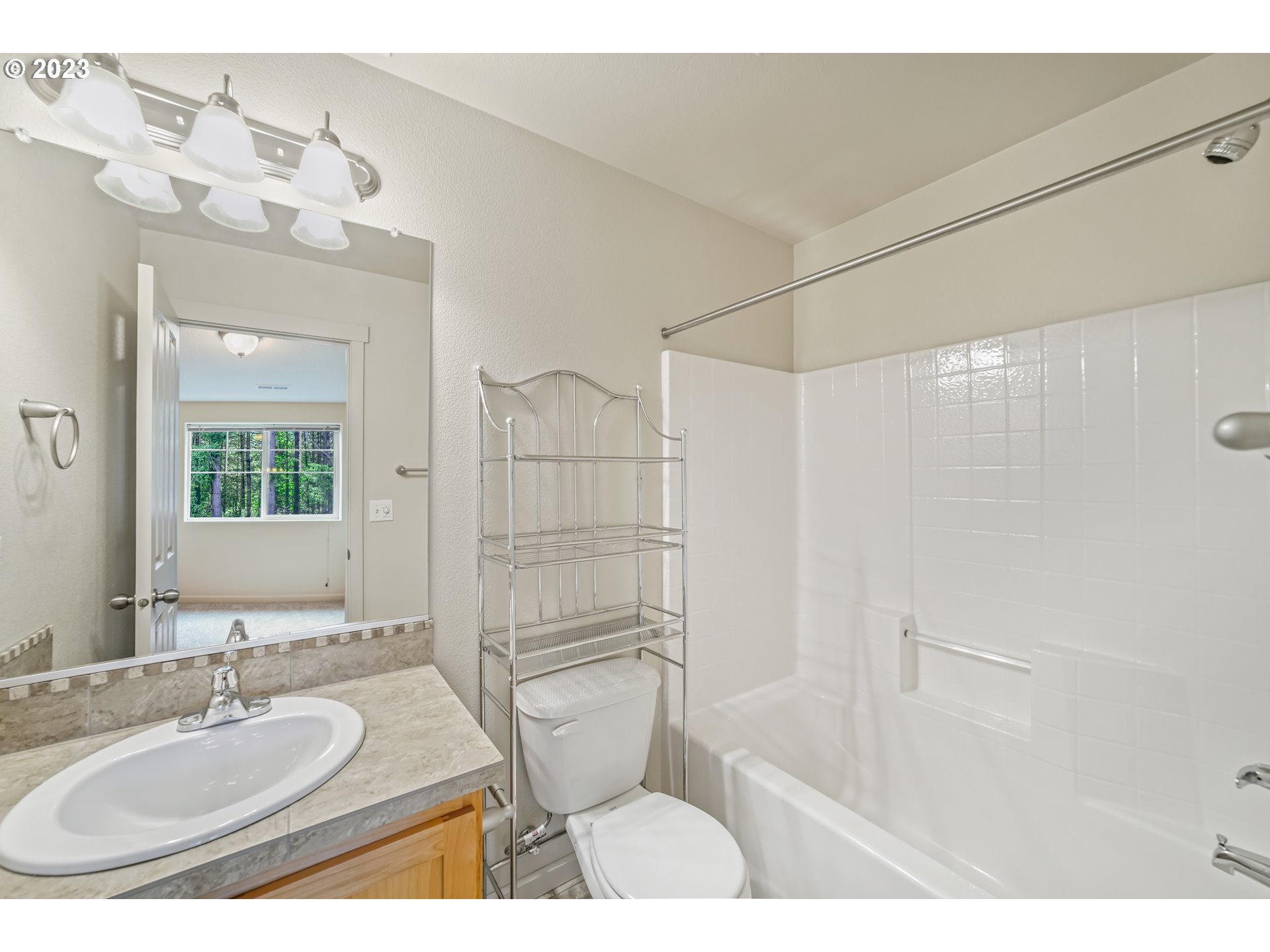 10595 Northeast Cedar Falls Loop Hillsboro, OR 97006 - Photo 14 of 27 a bathroom with a sink a toilet and shower