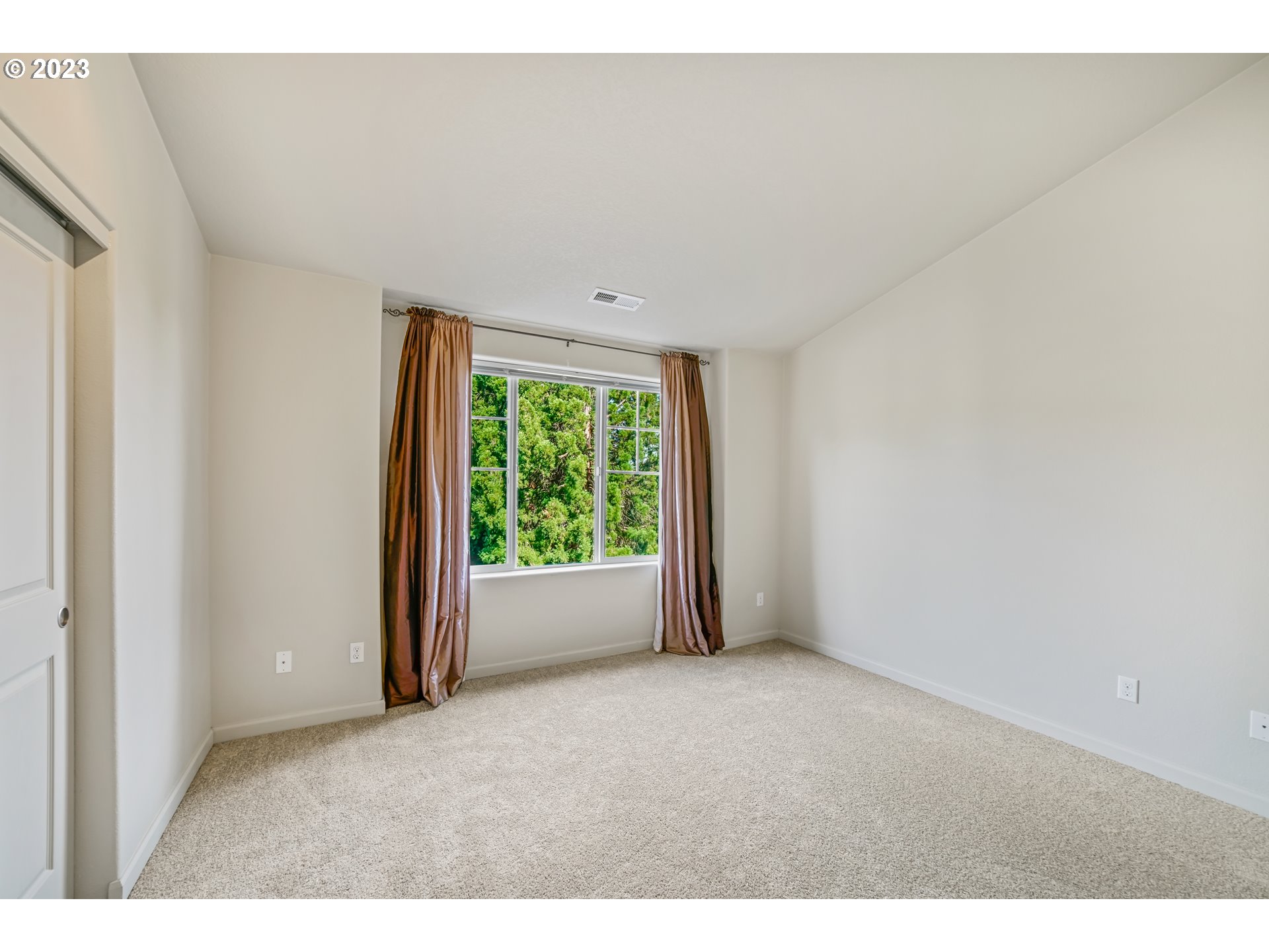 10595 Northeast Cedar Falls Loop Hillsboro, OR 97006 - Photo 17 of 27 a view of an empty room with a window