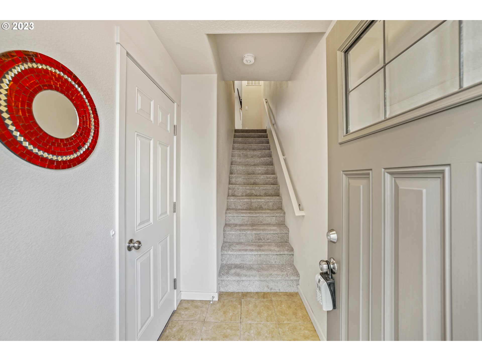 10595 Northeast Cedar Falls Loop Hillsboro, OR 97006 - Photo 2 of 27 a view of a room with staircase and a wooden floor