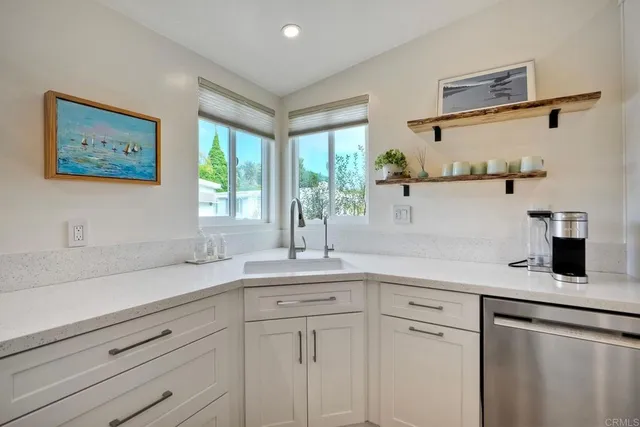 a kitchen with a sink and cabinets